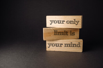 Three wooden blocks with the words your only limit is your mind