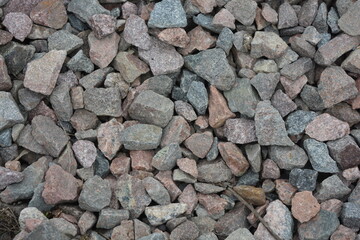 Construction, construction and repair materials. Beautiful and large stones, construction gray gravel poured with a handful.