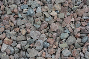Construction, construction and repair materials. Beautiful and large stones, construction gray gravel poured with a handful.