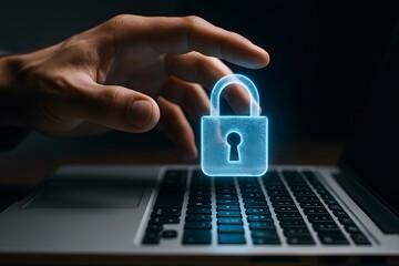 A hand reaching towards a glowing padlock superimposed over a laptop, symbolizing cybersecurity and online privacy protection. The image captures the essence of digital security and vigilance.