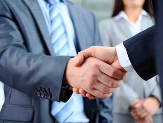 Confident business professionals are shaking hands and collaborating in a professional environment for successful deal