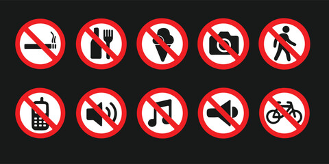 Collection of common prohibition signs with black icons on a dark background