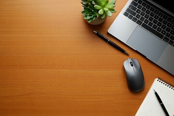 Top view office desk setup with laptop, pen, notebook, succulent and mouse on a clean wooden background for creative work.