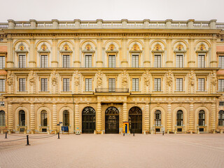 Fototapeta premium The Royal Palace in Stockholm, Sweden, stands in Baroque splendor with ornate stonework and grand symmetry—an iconic European landmark rich in royal history.