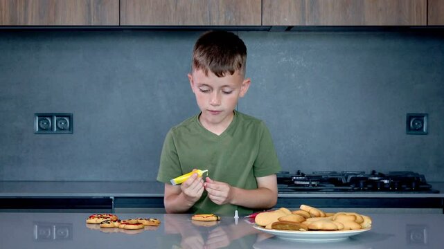 A focused child joyfully bakes colorful cookies with fun cutters and soft dough in a warm, creative kitchen