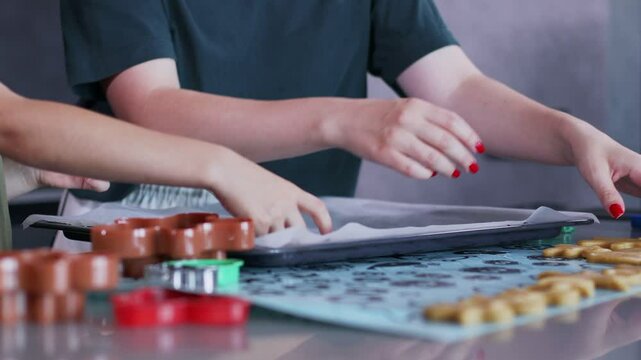 Mother and son bond over making gingerbread in their stylish kitchen.