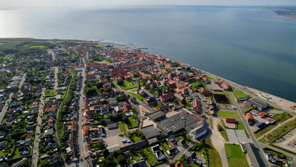Arial panoramic view of the old town of the coast city Logstor in Denmark on a sunny spring day

