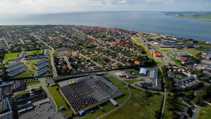 Arial panoramic view of the old town of the coast city Logstor in Denmark on a sunny spring day

