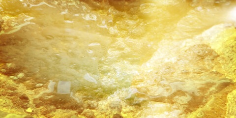 Close-up texture of natural gold silk. Light Golden fabric smooth texture surface background. Smooth elegant gold silk in Sepia toned. Texture, modern