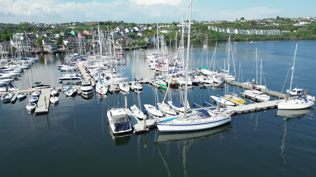 Kinsale, Ireland, May 20, 2024: The beautiful Kinsale Bay with Sailboats surrounded by the village of Kinsale with boats in the Bay.