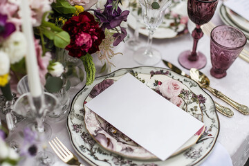 Blank Card on Floral Plate in Elegant Wedding Table Setting