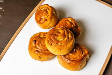 horizontal top view photo of whole wheat artisan bread mogolla style with peanuts, sweetened with honey, in a healthy vegetarian restaurant in Colombia