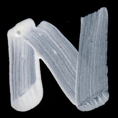 White Letter N draw in black background. JPG.