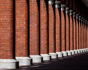 Red brick pillars form a colorful pattern in this image from Ybor City, FL