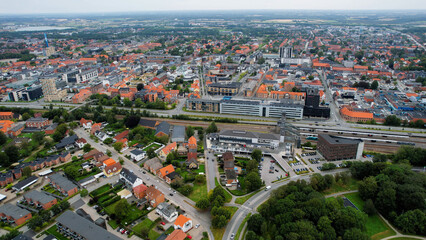 An arial panoramic view of the old town of the city Herning in Denmark on a cloudy spring day