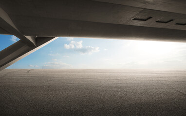 Perspective view of empty asphalt road platform under the bridge with beautiful sky view background. Mixed media.