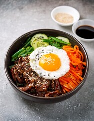 A bowl of Bibimbap with rice, sautéed vegetables, a fried egg, beef, and gochujang (Korean chili paste), garnished with sesame seeds. AI