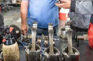 Engine pistons connecting rods mechanical parts car repair garage service tool maintenance workshop crankshaft auto industry.