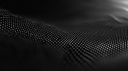 A black and white abstract digital wave pattern with a gradient effect.