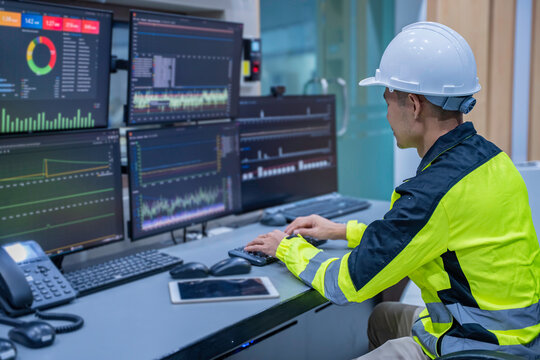 Engineer working at control room, Manager control system, Technician man monitoring program from a lot of monitor.
Specialist observes analytics dashboard,operator inspects digital interface - Powered by Adobe