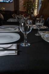 Elegant table setting for a gourmet dinner celebration with fine glassware and stylish cutlery in a modern restaurant ambiance