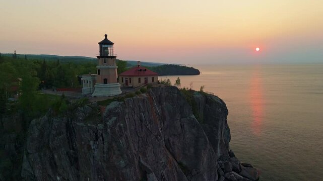 Breathtaking sunrise illuminating the historic Split Rock Lighthouse on Lake Superior's North Shore