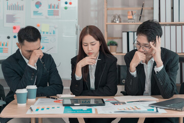 Businessmen and businesswomen brainstorming in conference room and working together in office....
