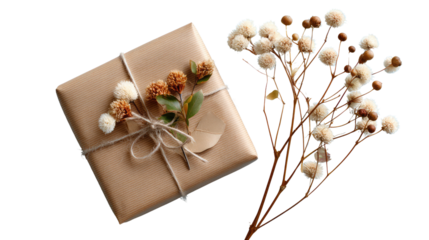 Wrapped Gift with Floral Charm: A beautifully wrapped gift, adorned with delicate flowers and rustic twine, rests beside a sprig of elegant blooms.