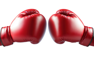 Red boxing gloves come together in a striking display of strength and precision during an intense boxing match at a local gym in the evening hours
