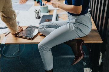 Group of business people gathered around a desk, actively brainstorming and collaborating on a...