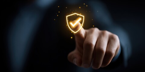 Hand touching glowing shield checkmark; dark background; security concept