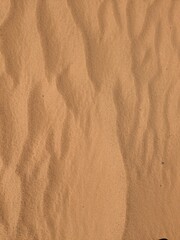 Orange color sand texture pattern background. Wadi Rum desert, Jordan,Arabia scenic beautiful panorama,Close-up of redorange sand on desert