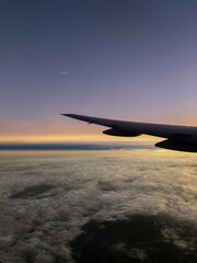 airplane in the cloudy line sky