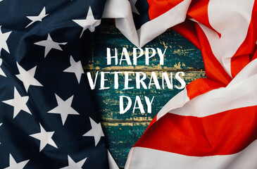 Flag with stars and a heart in the middle with the words Happy Veterans Day