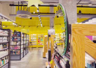 buying cosmetics, cream, shampoo in a perfume shop