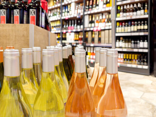 defocused alcohol (wine, champagne, liquor, whiskey) on store shelves