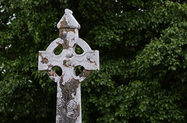 Old stone celtick cross in cemetery