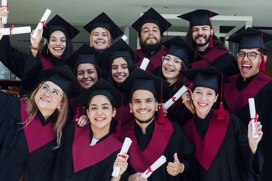 young Latin graduates students group celebrating at University campus in Mexico Latin America, portrait of hispanic people at college
