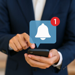 Person checking smartphone for a new notification alert with a bell icon