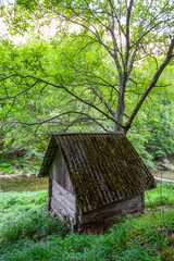 Old water mill for grinding grain on Cerna Valley, Romania, Europe