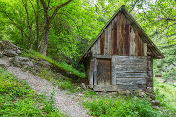 Old water mill for grinding grain on Cerna Valley, Romania, Europe