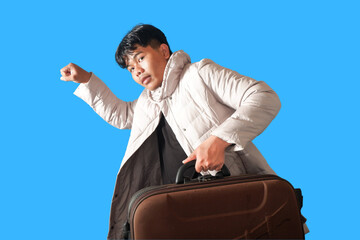 Young Man Hurrying with Luggage, Travel Rush, Departure  isolated on blue background