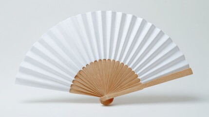 Stunning photo of mockup of a white folding hand fan set apart against a white background.