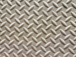 Close up of white checkerplate or tread plate. Seamless tread plate background texture