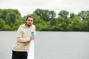 Sporty young man enjoys outdoor workout with fresh air and nature