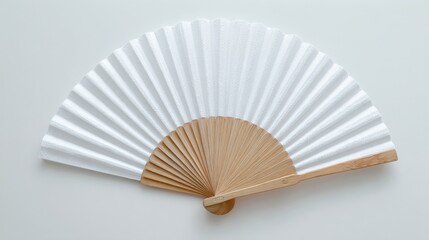 Stunning photo of mockup of a white folding hand fan set apart against a white background.