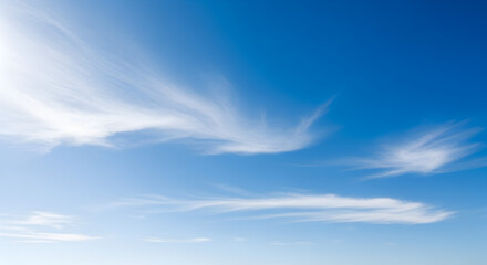Fototapeta premium Vibrant Blue Sky with Wispy Clouds A Serene and Peaceful Atmosphere for Backgrounds