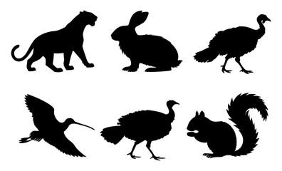 Silhouettes of various wild animals set