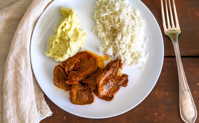 Classic rustic Brazilian food, beef tongue with rice and mashed potatoes. Real food
