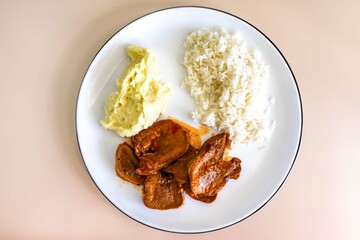 Classic rustic Brazilian food, beef tongue with rice and mashed potatoes. Real food